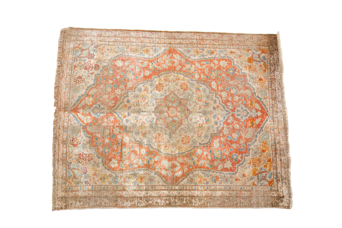 Antique Silk Tabriz mat with soft peach medallion and delicate floral motifs.