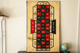 Lower right of vintage roulette board, highlighting 'EVEN' section and aged numbered squares.