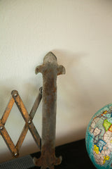 Rustic fleur de lis hardware with patina on the Deco accordion shaving mirror.