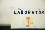 Painted 'Science for the People' graphic with fist, beaker, and partial 'LABORATORY' text.