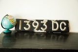 Art Deco silver '3 DC' with distressed black paint on vintage British license plate.