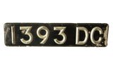 Vintage British license plate with raised Art Deco numbers 1393 DC, black and silver patina.