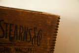 Vintage Frederick Stearns wooden crate, black Art Deco 'Stearns & Co' text, and dovetail joinery.