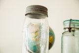 Raised Beaver lettering on clear antique mason jar with textured metal lid.