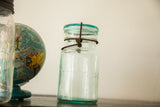 Blue Lightning mason jar with embossed text and original rusty wire bail lid.
