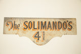 Vintage hand-painted 'The Solimando's 41' sign, art deco black and orange on ivory patina.