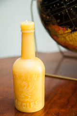 Close-up of the yellow beeswax candle, showing the embossed dragon and 'ARDIFF' text.