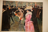 A woman in pink watches a high-kicking dancer in the vintage Moulin Rouge print.
