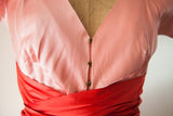 Vintage McCardell dress with distinctive brass hook-and-eye closure and red wrap sash.