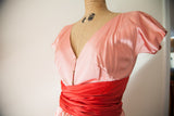 Pink bodice and red wrap sash of vintage Claire McCardell dress, brass hook and eye.