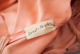 Cream Lord + Taylor retail tag on the peach vintage dress interior.