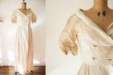 Vintage 1950s Lucie Ann ivory silk satin dressing gown with a wide collar and ruched sleeves.
