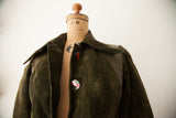 Vintage Gucci suede coat's pointed collar and iconic red and navy enamel buttons.
