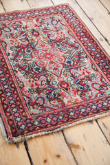 Intricate floral pattern in aqua, red, and creamy ivory on the unusual Sarouk's ivory field.