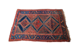 Antique Kurdish tribal rug featuring a blue and red geometric diamond design, 4'3