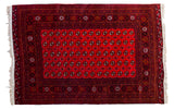 Vintage Turkmen Bokhara rug, rich cranberry red field with charcoal geometric gul motifs.