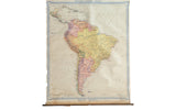 Vintage Denoyer Geppert circa 1919 South America pull down map, subtle pink, yellow, off-white colors, aged patina.
