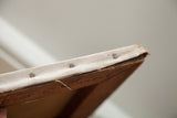 Antique canvas tacked and stretched over the painting's original wooden frame.