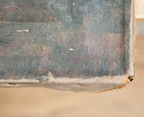 Detail of the antique oil painting's worn canvas corner and dark, textured paint.