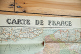 Close-up of antique France map title, showing subtle pastel tones and aged creases.