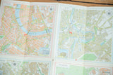 Detailed street grids of Basel and Bern on the folded vintage map of Switzerland.