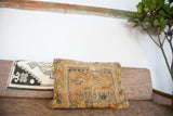 Antique Orange Caucasian Pillow featuring geometric patterns in orange, yellow, and blue.