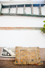 Side view of the Antique Orange Caucasian Pillow, showing its aged circa 1900 geometric motif.