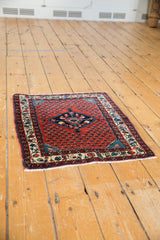Vintage Persian Engelas rug mat in a room setting, displaying its scale and rich, geometric pattern.