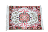 Vintage Persian Tabriz mat featuring a cream field, central peach medallion, and floral vine designs, 1' x 1'4