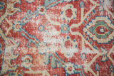 Curvilinear allover pattern of Sultanabad fragment in grapefruit red, ivory, blue, green.