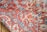 Sultanabad fragment's professionally secured side and hand-knotted construction with red, ivory, blue.