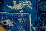 Antique Chinese Peking rug: detailed phoenix on rich cobalt pile and secured side.