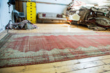 Antique distressed Malayer gallery runner featuring faded raspberry red and soft ivory hues.