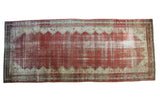 Distressed Antique Persian Malayer gallery runner with raspberry cinnabar red Mir-boteh field.