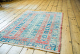 Distressed Vintage Turkish Sparta rug with raspberry, aqua, seafoam geometric patterns.