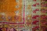 Distressed vintage Turkish Kula prayer rug, burnt orange field and geometric animal motifs.
