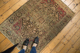 Antique Farahan Sarouk rug showing its complex floral pattern with raspberry, blue, and charcoal accents.