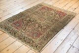 Overall traditional pattern of an antique Farahan Sarouk rug in raspberry, charcoal, and greige.