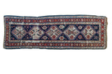 Antique Caucasian runner with distressed deep blue, ruby red, and cream patterns, 3'5