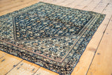 Reduced border and hand-secured side on an antique Persian Farahan Sarouk rug.