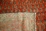 Hand-knotted foundation and brick red boteh pile of an antique Persian Malayer rug.