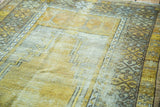 Distressed gold field, Ladik style Mehrabs, and geometric beige borders.