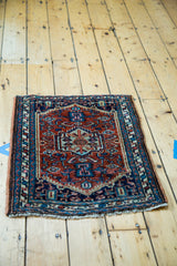 Vintage Hamadan rug showing rusty brick red field, Herati design, and blue border.