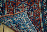 Hand-knotted foundation, distinct herati design, and fine fringe of a vintage Persian Hamadan rug.