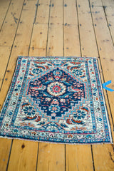 Diminutive vintage 1940s Hamadan rug mat, blue medallion, ivory field, herati motifs.