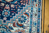Ivory, blue, and pink intricate herati-style motifs on a vintage Hamadan rug.