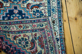 Vintage Hamadan rug border detail showcasing intricate blue, ivory, and pink patterns.