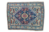 Vintage Persian Hamadan mat with expressive deep blue medallion and ivory field, featuring herati motifs.