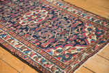 Vintage 1950s Persian Lilihan, dark blue field with red floral motifs and leaf border.