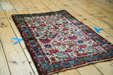 Vintage Persian Hamadan rug showcasing ivory field's blossoming flowers, birds, and light blue border.